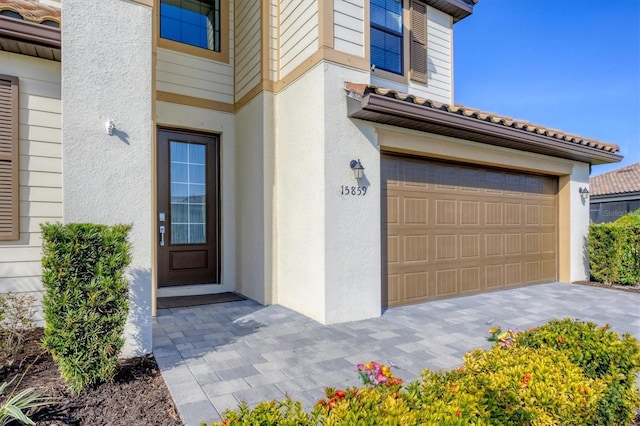 entrance to property featuring a garage