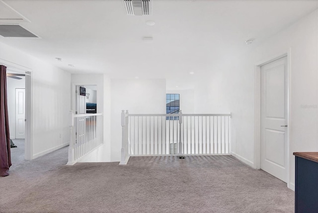 empty room with light colored carpet