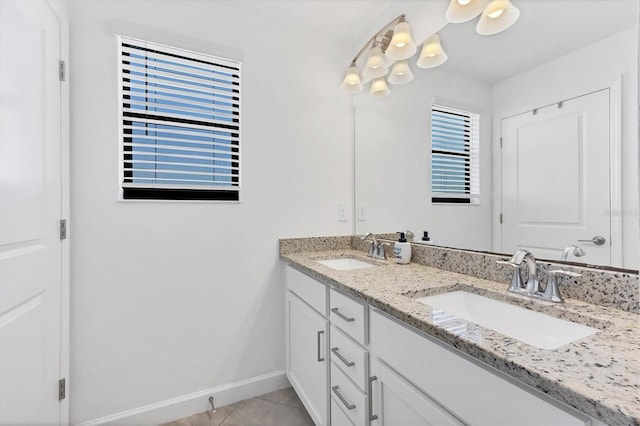 bathroom with tile patterned floors and vanity