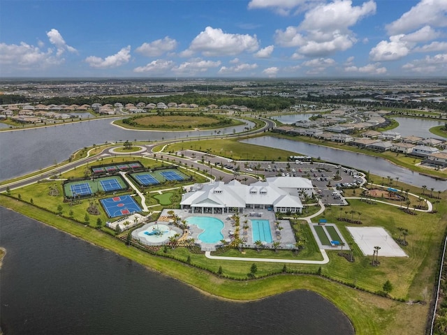 birds eye view of property with a water view