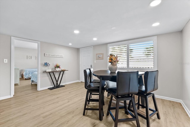 dining area featuring light wood-type flooring