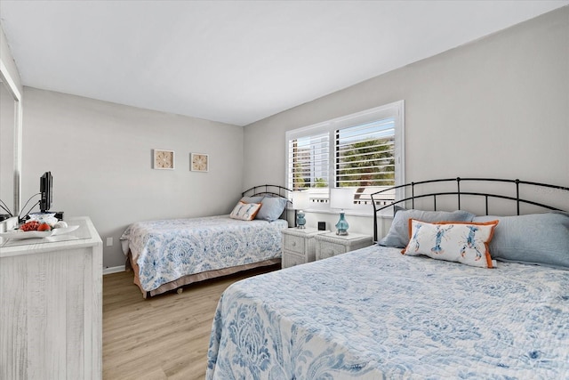 bedroom with light hardwood / wood-style floors