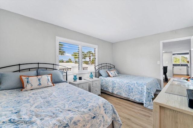 bedroom featuring light wood-type flooring