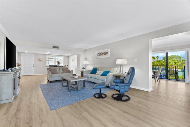 living room with light hardwood / wood-style flooring