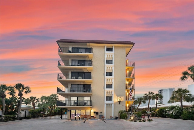 view of outdoor building at dusk