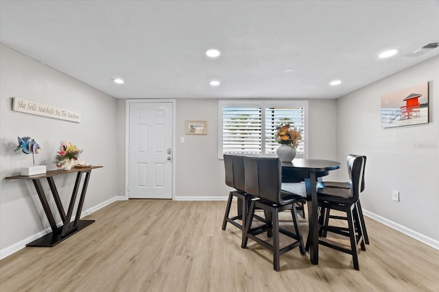 dining space with light wood-type flooring