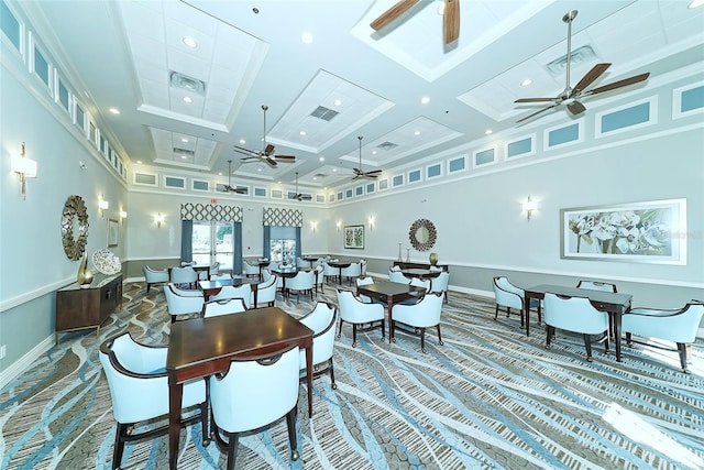 dining space featuring beam ceiling, ceiling fan, a high ceiling, and coffered ceiling