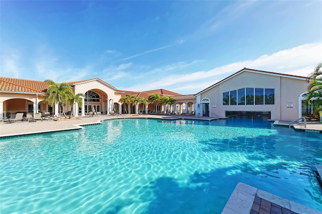 view of swimming pool featuring a patio area