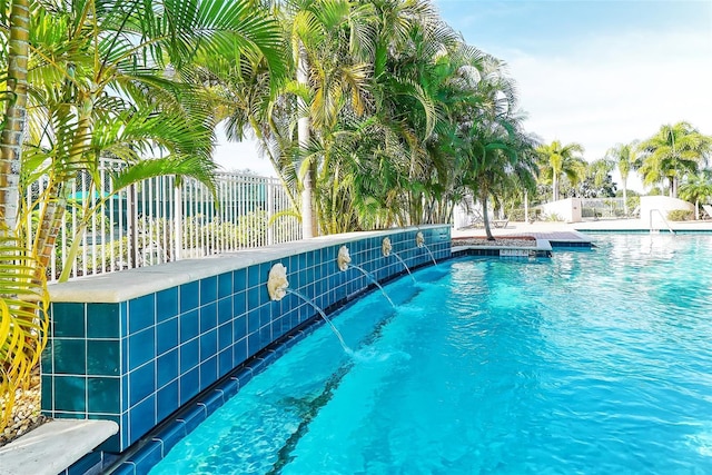 view of pool with pool water feature