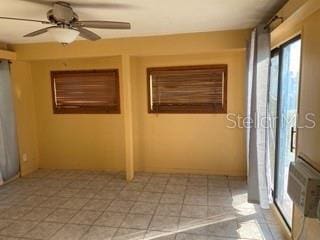 empty room featuring ceiling fan