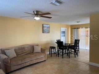 living room featuring ceiling fan