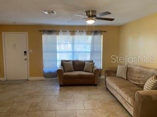 living room featuring ceiling fan