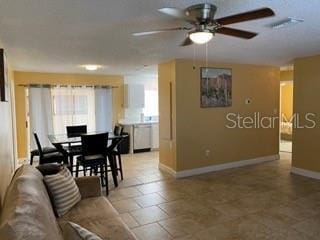 living room with ceiling fan