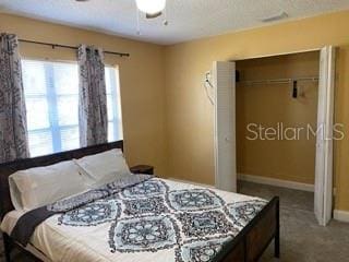 bedroom featuring a closet and carpet floors