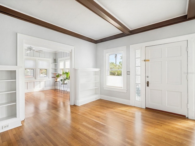 entrance foyer with beamed ceiling, light wood-type flooring, and ceiling fan