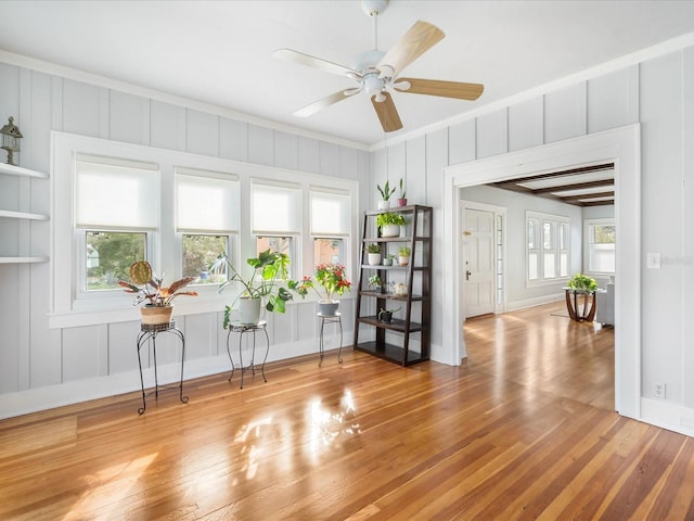 interior space with light wood-type flooring and ceiling fan