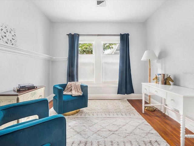 sitting room with hardwood / wood-style floors