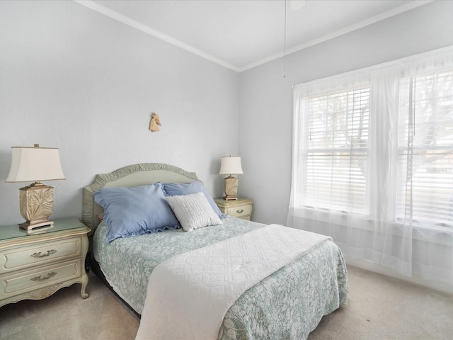 carpeted bedroom featuring multiple windows and crown molding