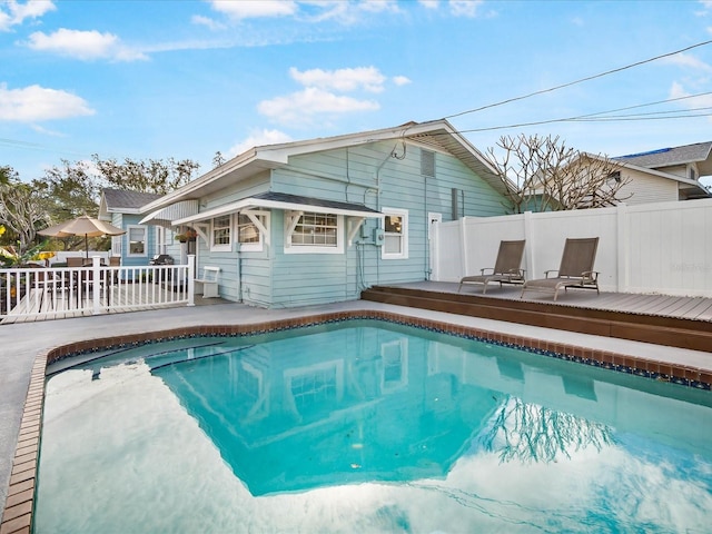 view of swimming pool featuring a wooden deck