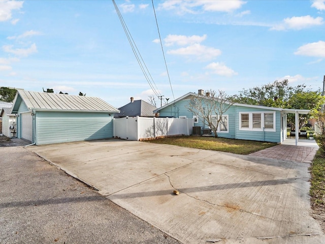 view of front of home with a front lawn and a garage