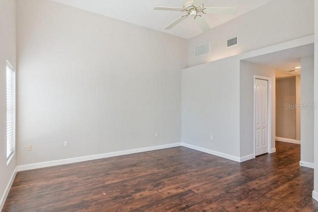 unfurnished room featuring ceiling fan and dark hardwood / wood-style floors