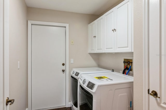 laundry area featuring cabinets and washing machine and dryer