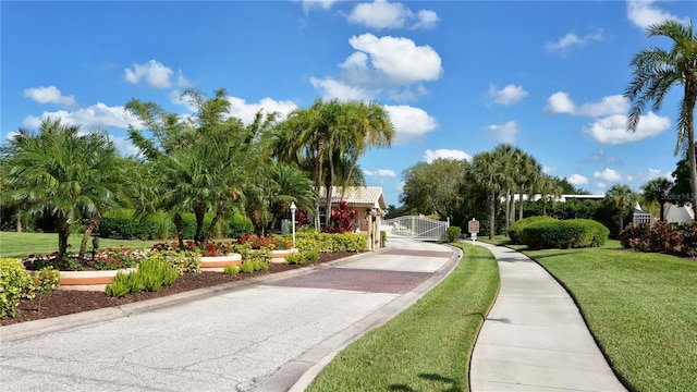 view of home's community featuring a lawn