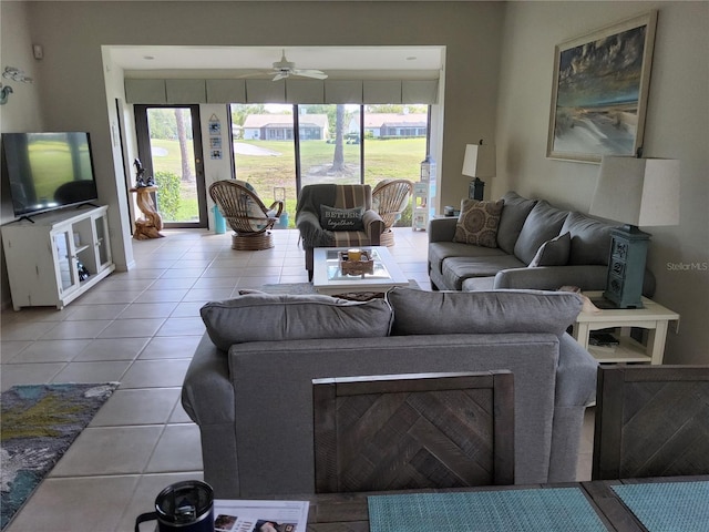 living room with ceiling fan, light tile patterned floors, and a wealth of natural light