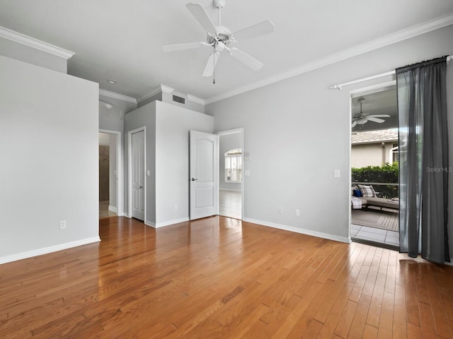 unfurnished bedroom with ceiling fan, hardwood / wood-style floors, and crown molding