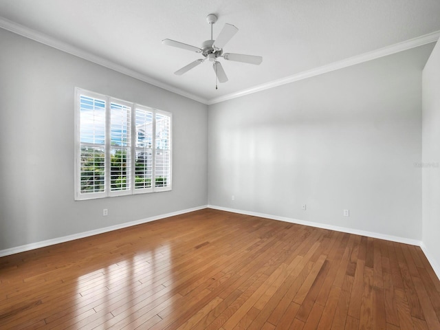 unfurnished room with hardwood / wood-style flooring, ceiling fan, and crown molding