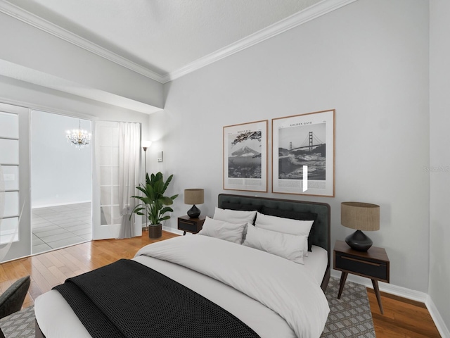 bedroom with a chandelier, hardwood / wood-style flooring, and crown molding