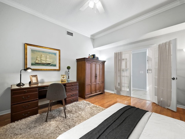 bedroom with ceiling fan, ornamental molding, and light hardwood / wood-style flooring