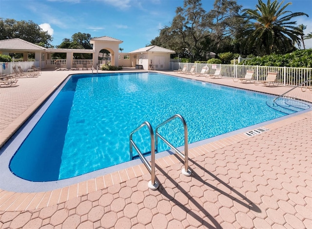 view of swimming pool featuring a patio area