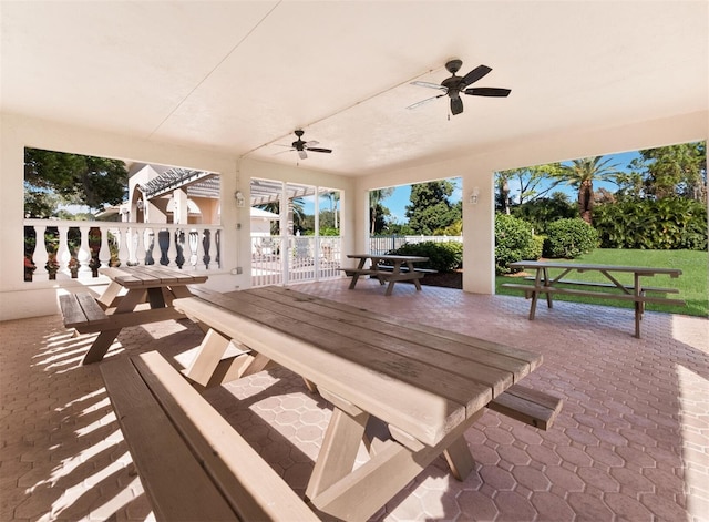 view of patio featuring ceiling fan