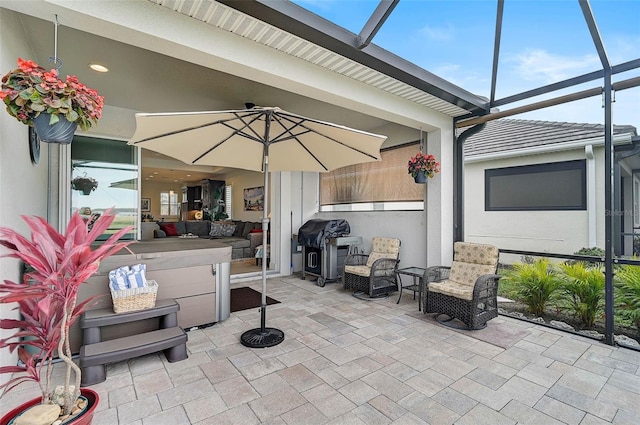 view of patio / terrace with a lanai and grilling area