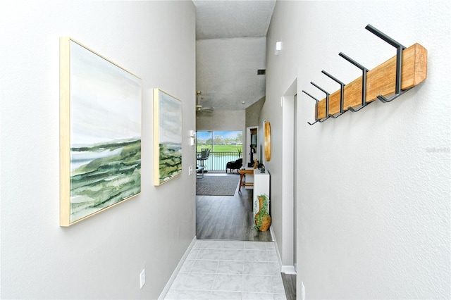 hall with light tile patterned flooring