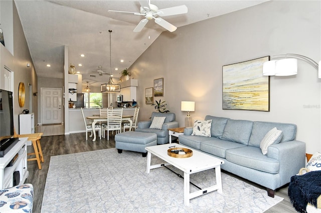 living room featuring ceiling fan, hardwood / wood-style floors, and high vaulted ceiling