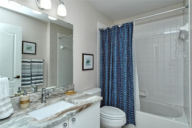 full bathroom with vanity, toilet, and shower / tub combo