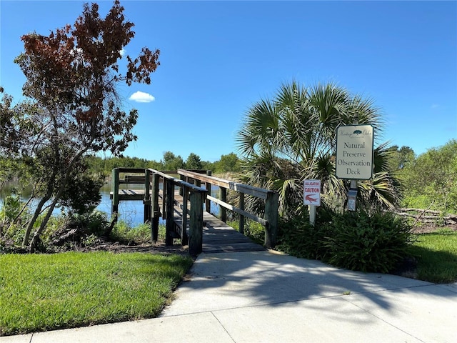 view of community with a water view