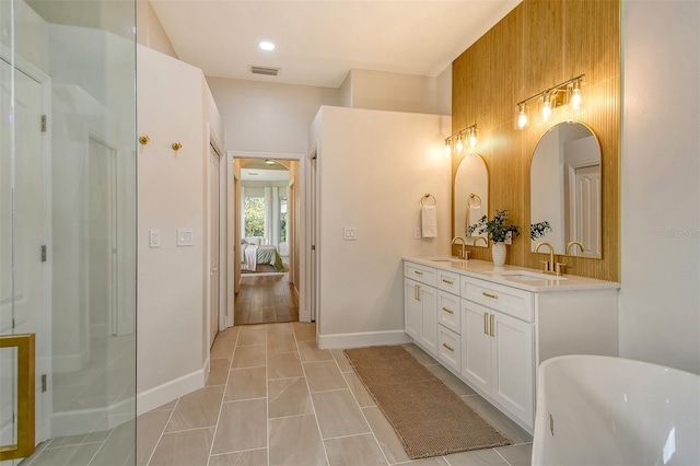 bathroom with vanity, tile patterned floors, and shower with separate bathtub