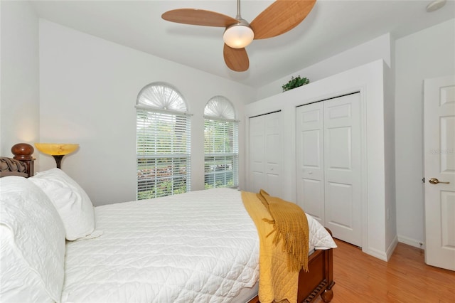 bedroom with light hardwood / wood-style flooring and ceiling fan