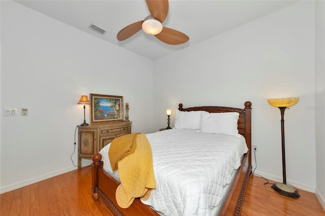 bedroom featuring ceiling fan and hardwood / wood-style flooring