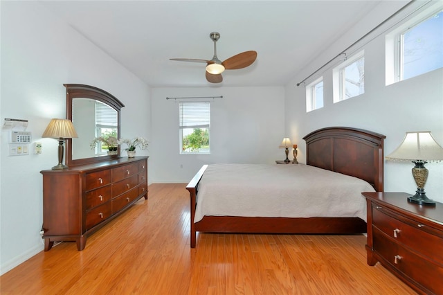 bedroom with ceiling fan and light wood-type flooring