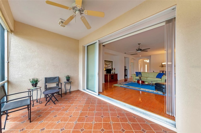 view of patio featuring ceiling fan