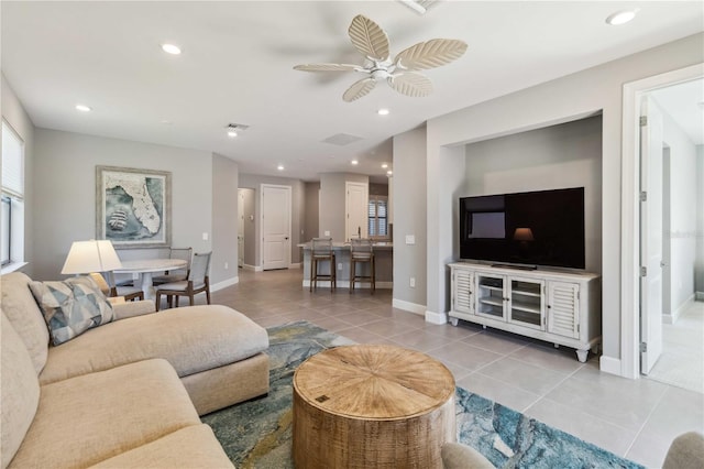 living room featuring tile patterned floors and ceiling fan