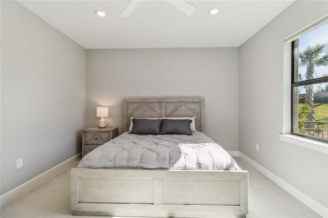 carpeted bedroom featuring ceiling fan