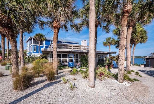 view of front of house featuring a water view