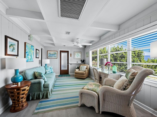 living room featuring beamed ceiling, wood-type flooring, ceiling fan, and coffered ceiling