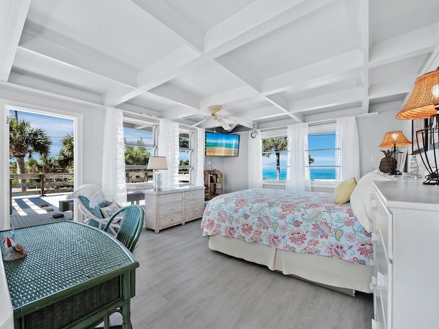 bedroom featuring access to exterior, light wood-type flooring, coffered ceiling, ceiling fan, and beamed ceiling