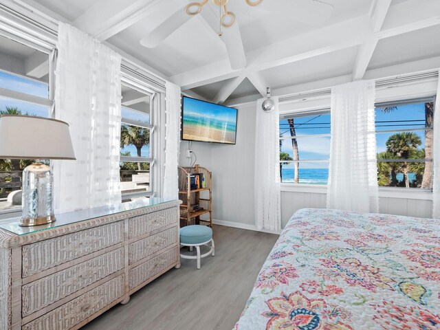 1620 Casey Key Rd, Nokomis, FL 34275 - bedroom featuring wood finished floors, coffered ceiling, beamed ceiling, multiple windows, and ceiling fan
